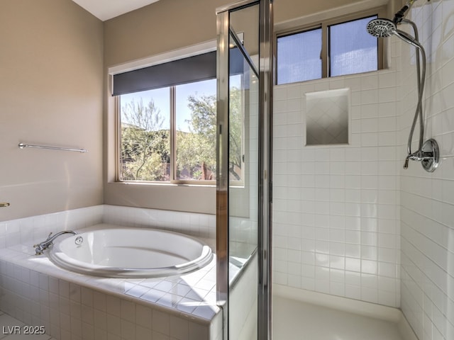 bathroom with shower with separate bathtub