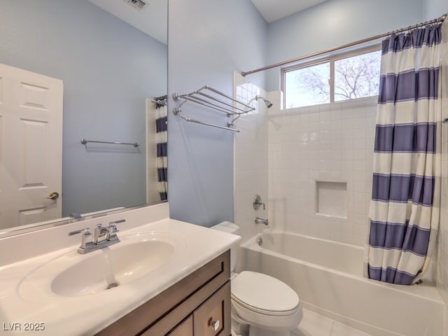 full bathroom with vanity, tile patterned floors, toilet, and shower / bath combo with shower curtain