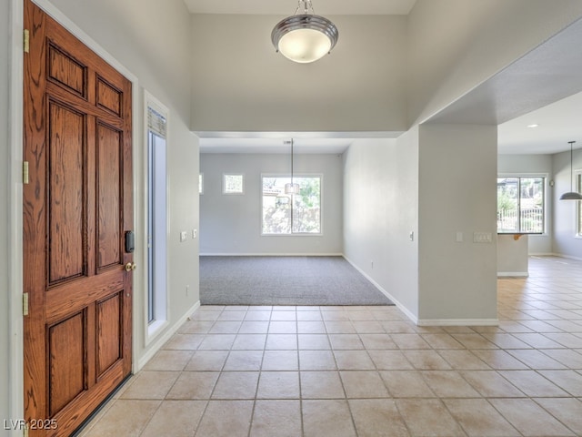 foyer entrance with light tile patterned floors