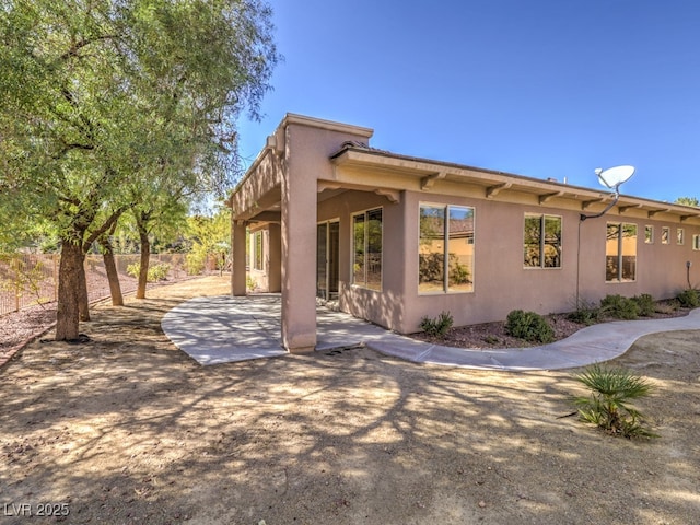 rear view of house featuring a patio