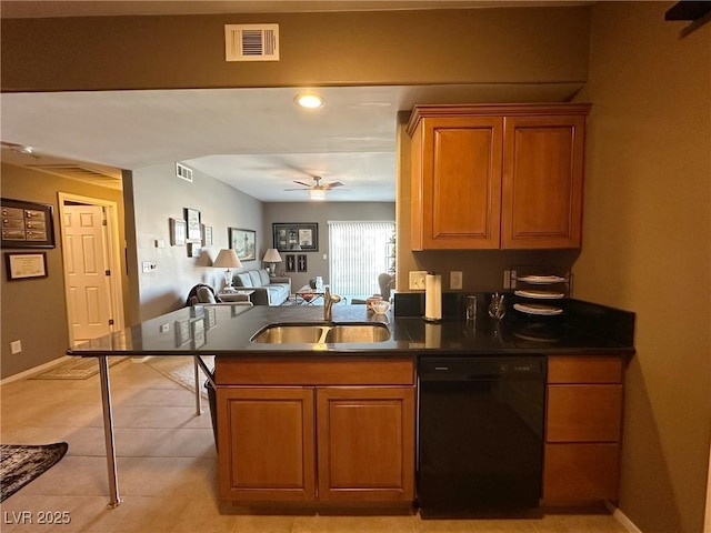 kitchen featuring sink, light tile patterned floors, dishwasher, ceiling fan, and kitchen peninsula