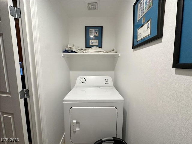 washroom with washer / dryer