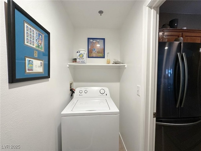 washroom with washer / clothes dryer