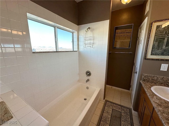 bathroom with tile patterned flooring, vanity, and bathtub / shower combination