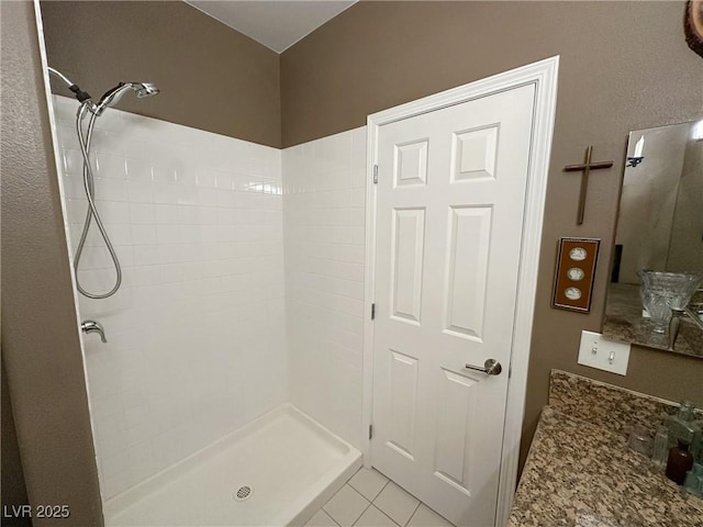 bathroom with walk in shower and tile patterned floors