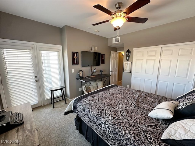 carpeted bedroom featuring a closet and ceiling fan