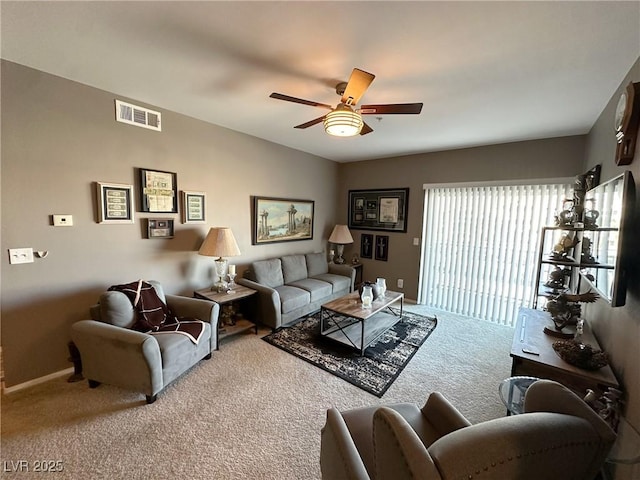 living room with carpet floors and ceiling fan