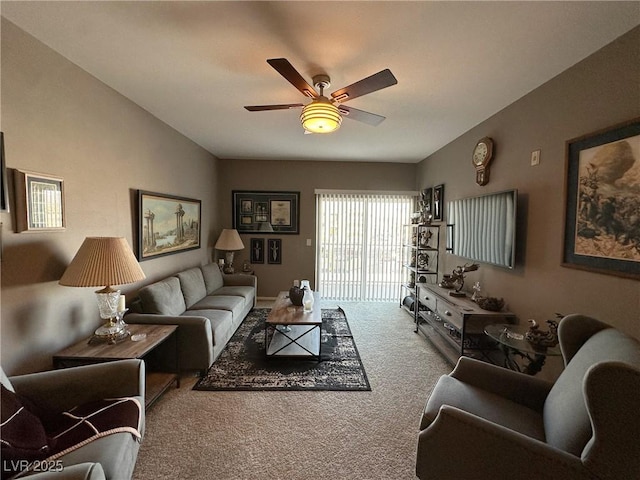 carpeted living room with ceiling fan