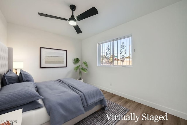 bedroom featuring ceiling fan and wood-type flooring