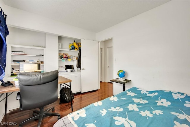 bedroom featuring hardwood / wood-style floors