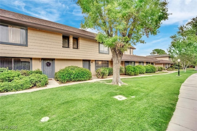 view of property featuring a front yard