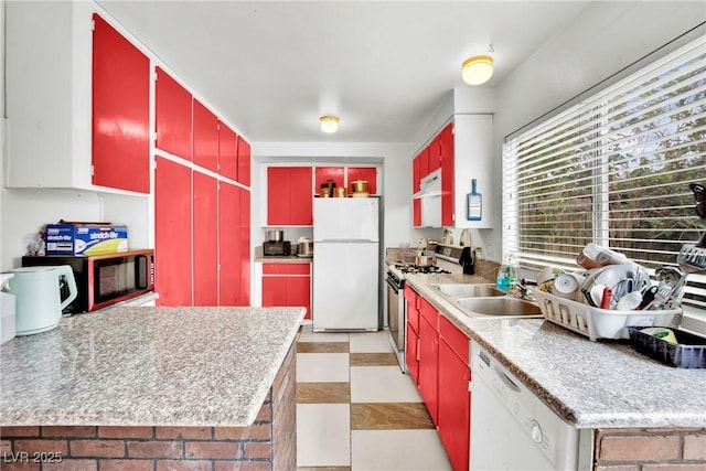 kitchen with sink and white appliances