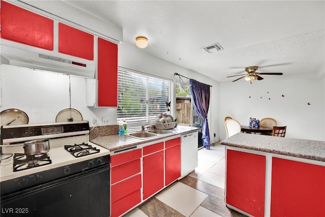 kitchen featuring sink, ceiling fan, white dishwasher, a textured ceiling, and range with gas cooktop