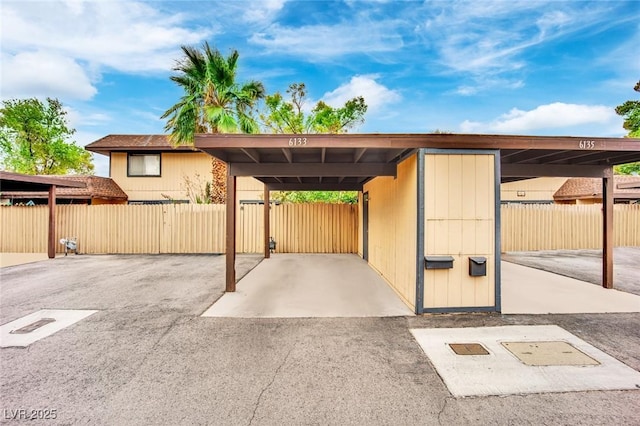 exterior space with a carport