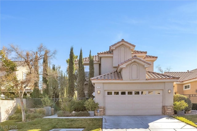 mediterranean / spanish-style house featuring a garage