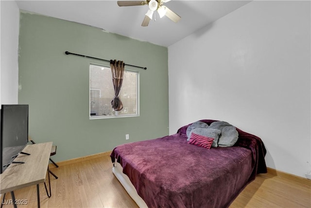 bedroom featuring ceiling fan and light hardwood / wood-style floors