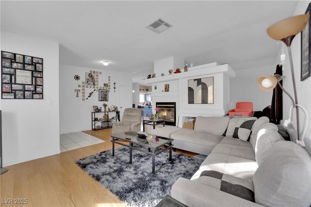 living room with light hardwood / wood-style floors