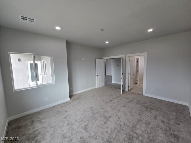 empty room with light colored carpet