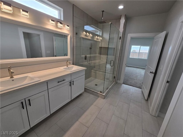 bathroom featuring vanity, tile patterned flooring, and a shower with door