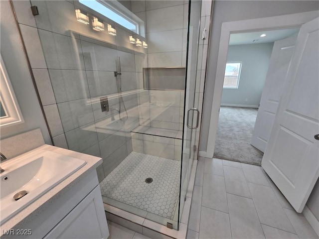 bathroom featuring vanity, an enclosed shower, and tile patterned flooring