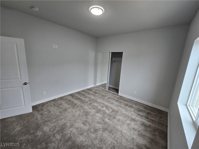 unfurnished bedroom with a closet and carpet