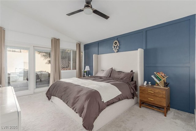 bedroom featuring lofted ceiling, access to exterior, a ceiling fan, and light colored carpet