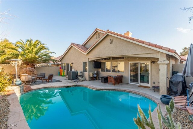 view of swimming pool featuring area for grilling, central AC unit, and a patio area