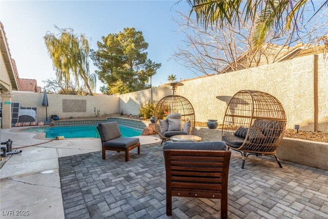 view of patio / terrace featuring a fenced in pool