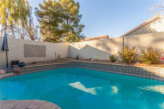 view of pool featuring a fenced backyard and a fenced in pool