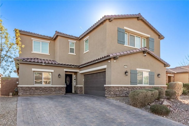 mediterranean / spanish-style house with a garage