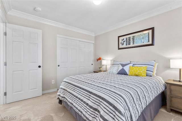 carpeted bedroom featuring crown molding and a closet