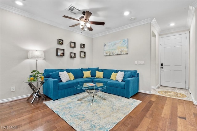 living room featuring crown molding, ceiling fan, and dark hardwood / wood-style flooring