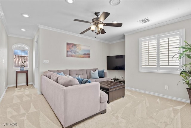 living room with ornamental molding, light colored carpet, and ceiling fan