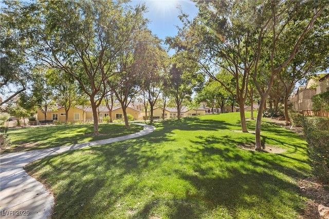 view of home's community featuring a lawn