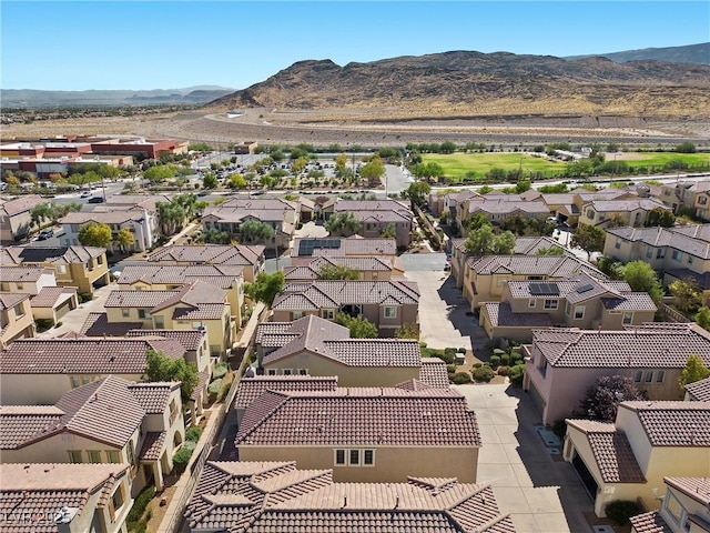 birds eye view of property with a mountain view