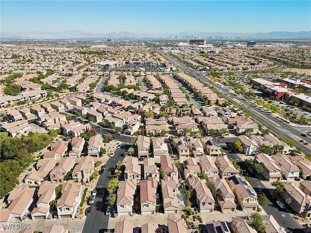 birds eye view of property with a mountain view