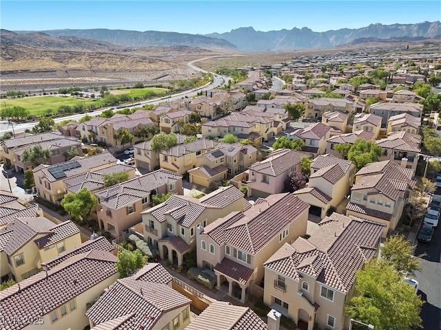 birds eye view of property featuring a mountain view