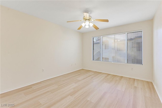 unfurnished room featuring ceiling fan and light wood-type flooring