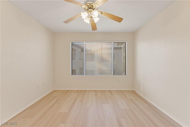 unfurnished room with ceiling fan and light wood-type flooring