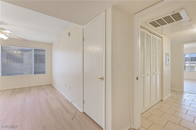 hallway with light tile patterned flooring