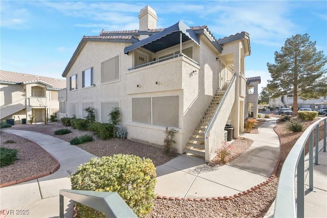 view of property exterior with a balcony