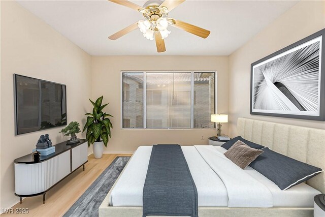 bedroom featuring light hardwood / wood-style flooring and ceiling fan