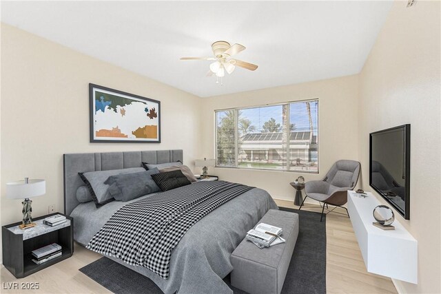 bedroom featuring ceiling fan and light wood-type flooring