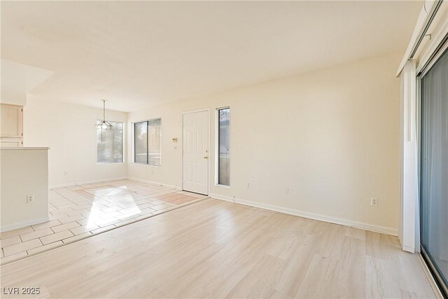 unfurnished living room with light wood-type flooring