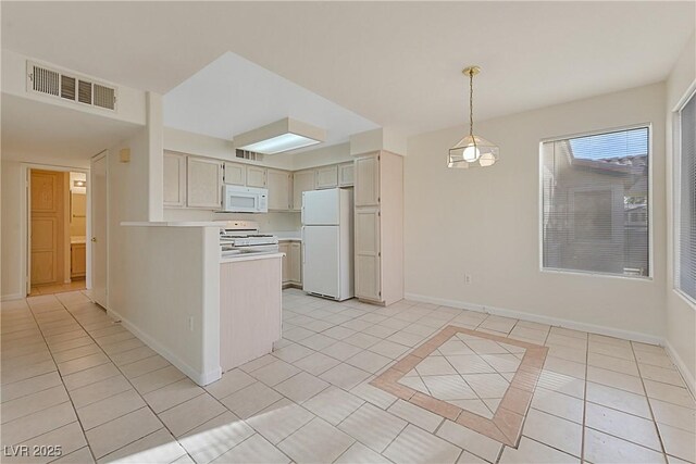 kitchen with pendant lighting, white appliances, and light tile patterned floors