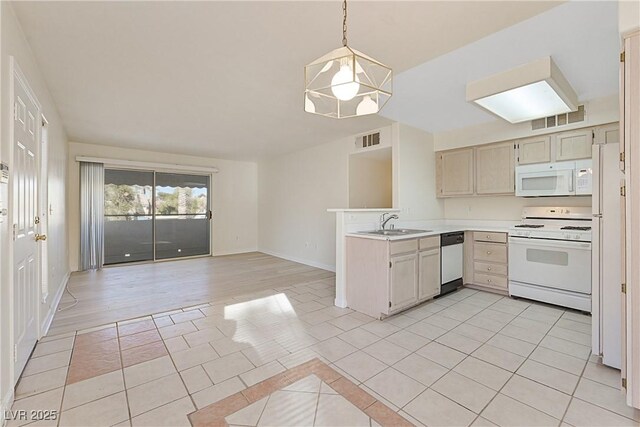 kitchen with sink, hanging light fixtures, light tile patterned floors, kitchen peninsula, and white appliances