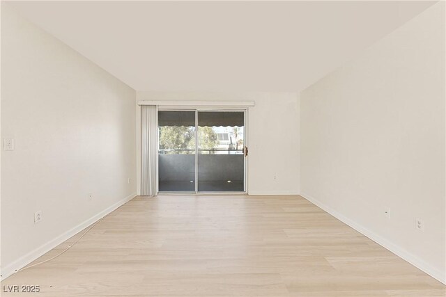 unfurnished room with light hardwood / wood-style floors