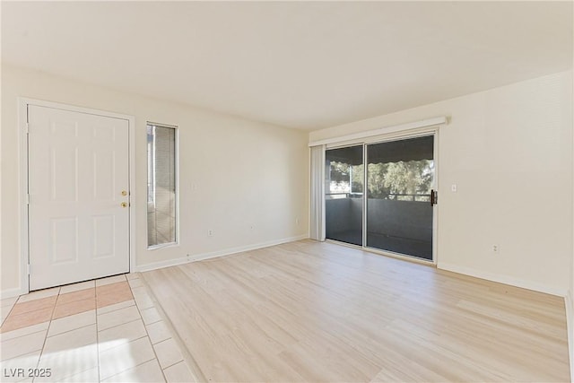 unfurnished room featuring light tile patterned floors