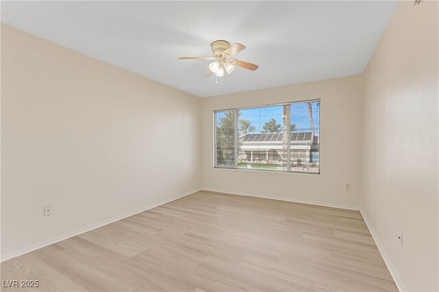 unfurnished room with ceiling fan and light wood-type flooring