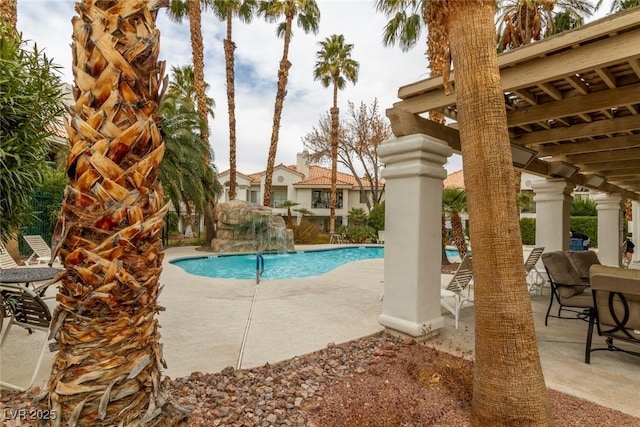 view of pool featuring a patio area and pool water feature